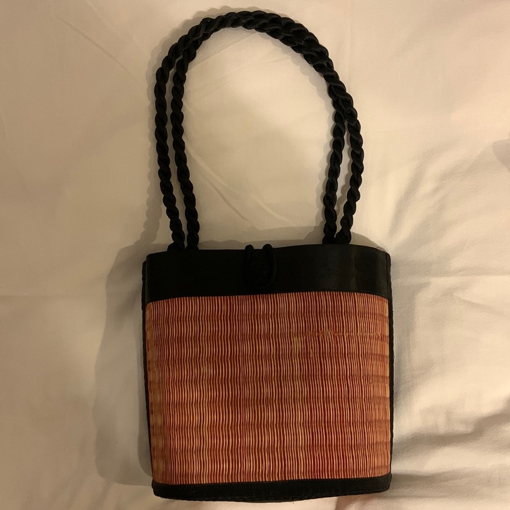 Woven purse/satchel with black clasp and handles